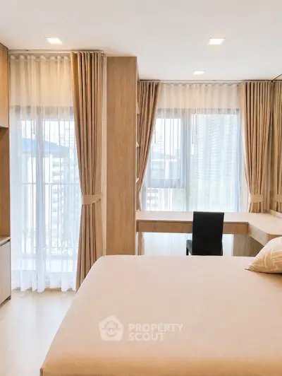 Luxurious bedroom with floor-to-ceiling windows and elegant curtains