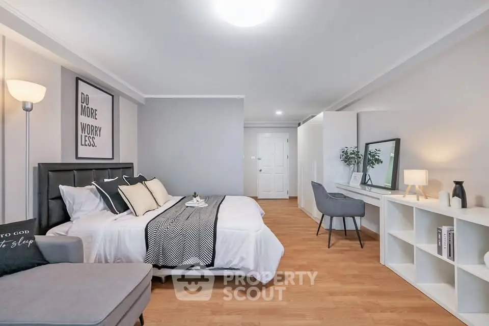 Spacious modern bedroom with stylish decor and cozy ambiance