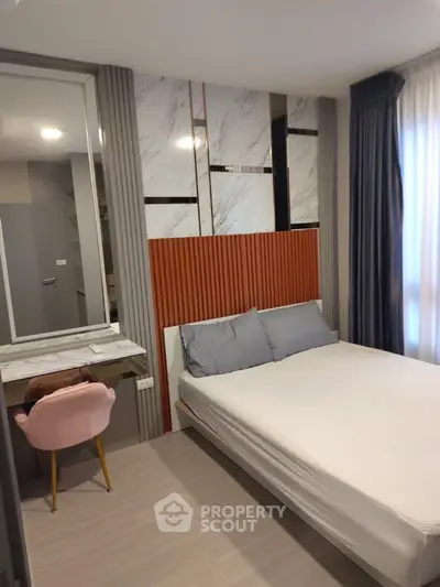 Modern bedroom with stylish decor and cozy ambiance, featuring a comfortable bed and elegant furnishings.