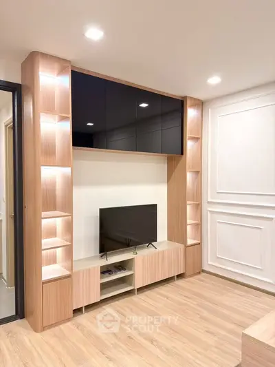 Modern living room with sleek wooden entertainment center and ambient lighting