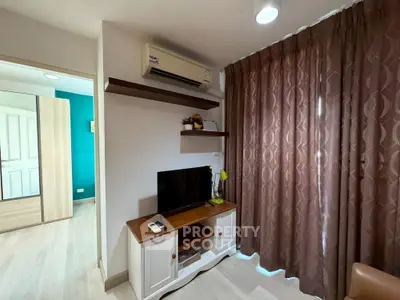 Cozy living room with air conditioning and modern TV setup