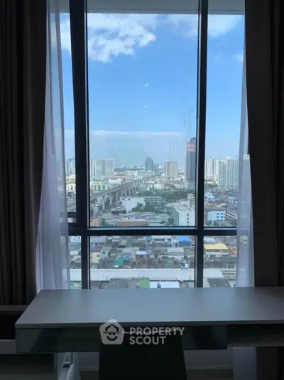 Stunning cityscape view from a high-rise apartment window, perfect for urban living enthusiasts.