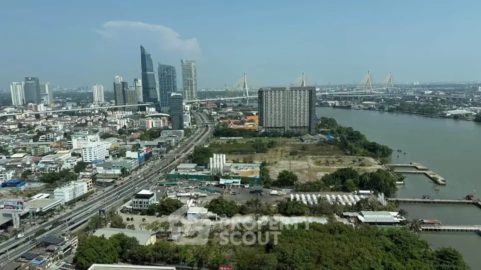 Stunning aerial view of urban skyline with river and modern skyscrapers, perfect for real estate investment.