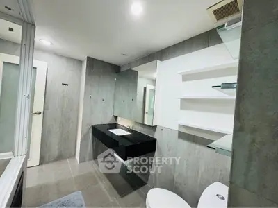 Modern bathroom with sleek design and floating vanity in a contemporary home.
