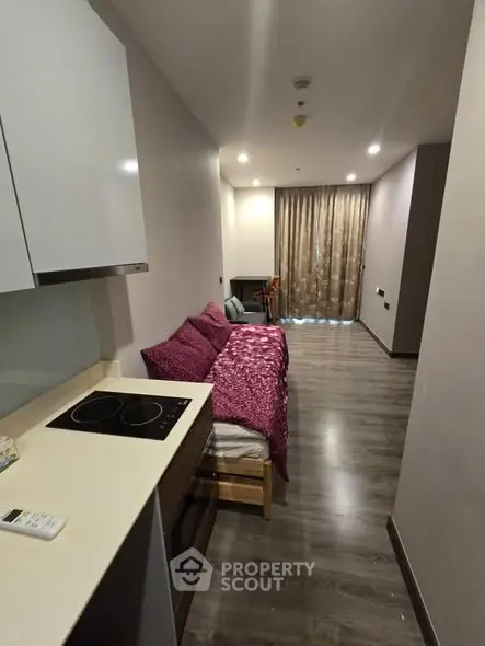 Cozy studio apartment with modern kitchen and stylish decor