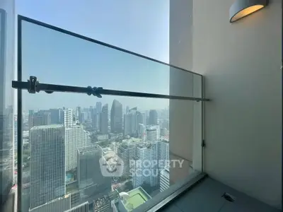 Stunning high-rise balcony with panoramic city skyline view, perfect for urban living enthusiasts.