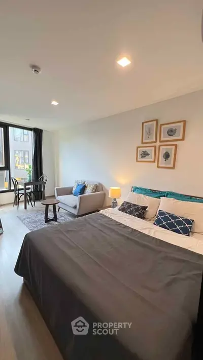 Modern studio apartment with cozy living area and stylish decor