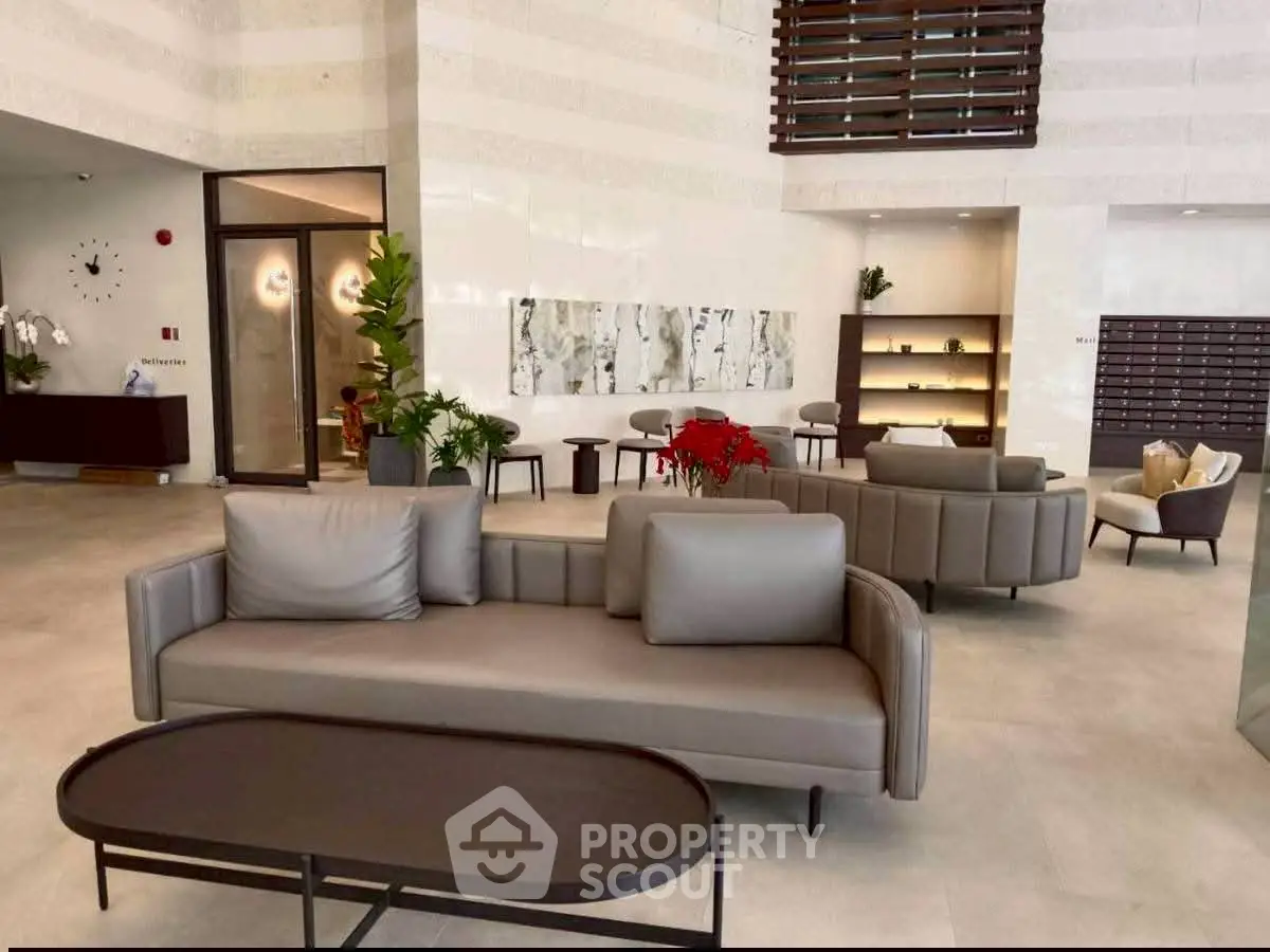 Luxurious modern lobby with elegant seating and contemporary decor in a high-end residential building.