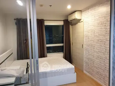 Modern bedroom with city view and stylish brick accent wall