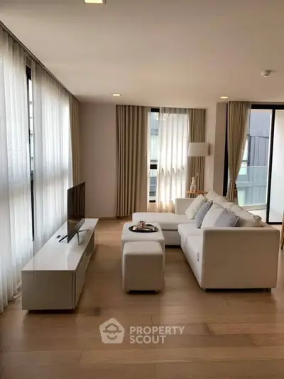 Spacious modern living room with elegant decor and natural light