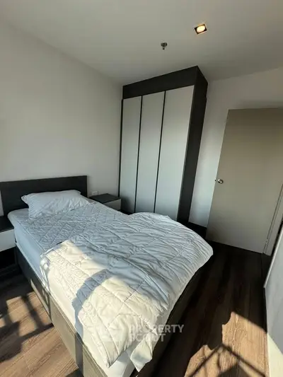 Cozy bedroom with modern design and ample natural light