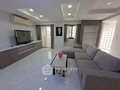 Spacious modern living room with sleek design and large sectional sofa