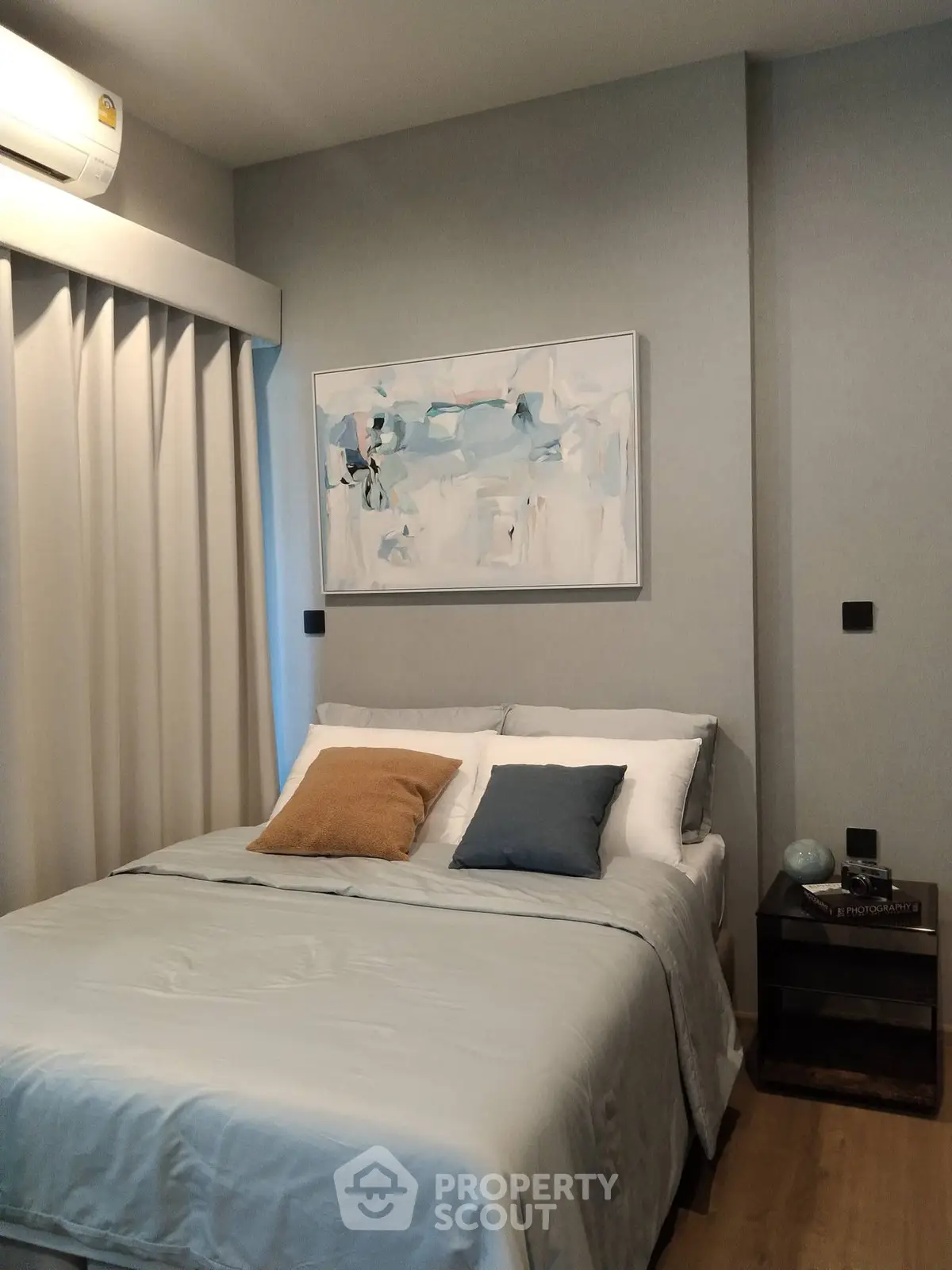 Cozy modern bedroom with stylish decor and soft lighting