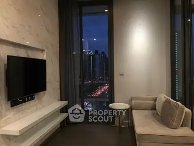 Modern living room with city view, featuring sleek marble wall and cozy sofa.