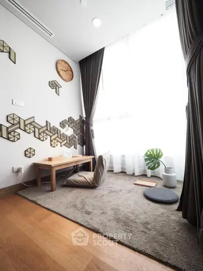 Cozy minimalist living room with modern decor and large window
