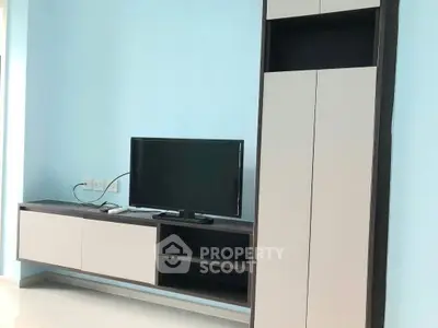 Modern living room with sleek TV cabinet and storage unit