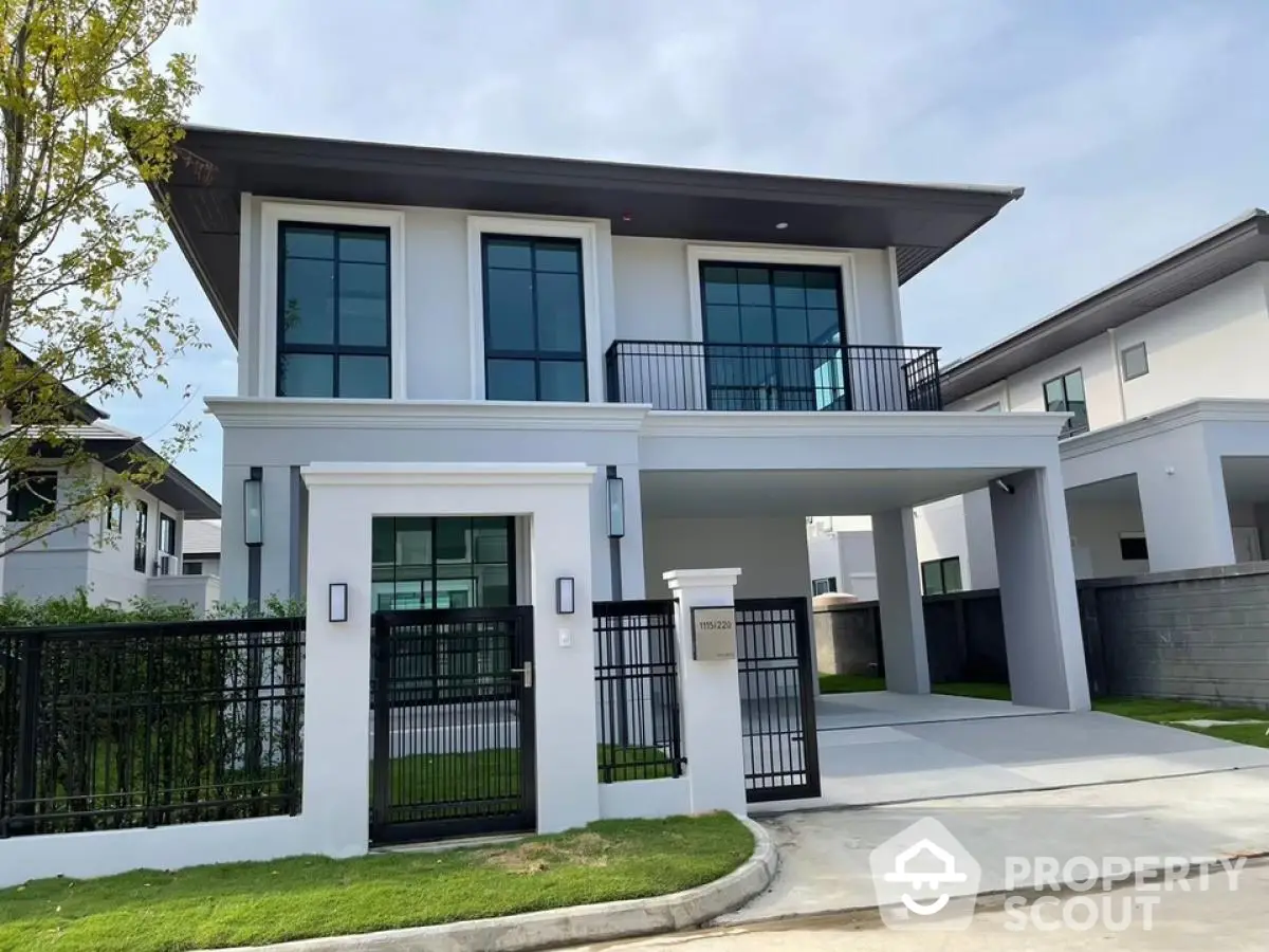 Modern two-story house with sleek design and spacious driveway