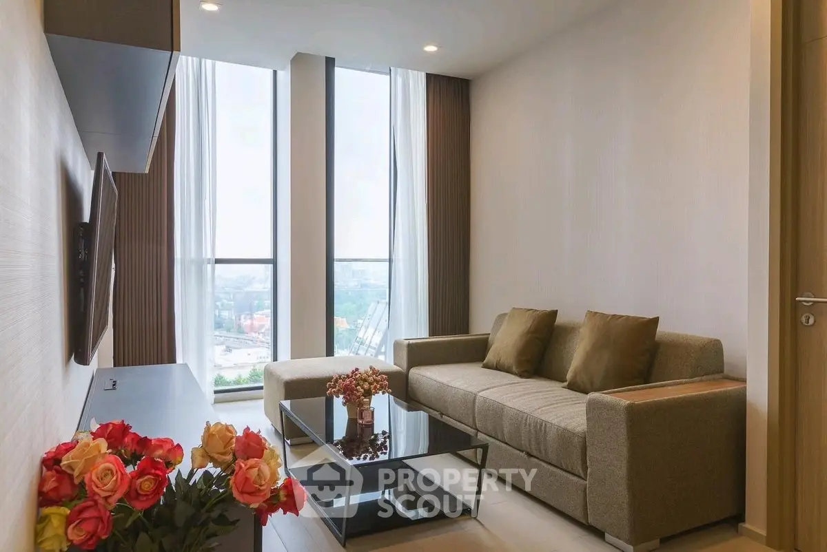 Modern living room with large windows and stylish decor