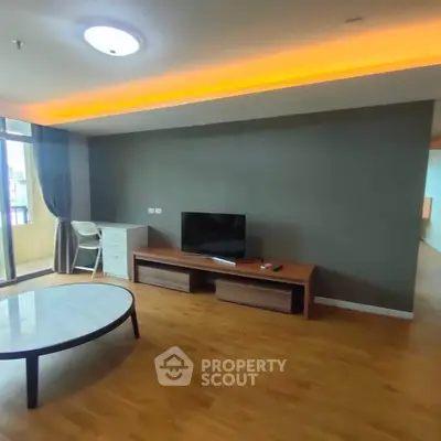 Spacious living room with modern decor and natural light