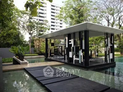 Luxurious modern poolside pavilion with sleek design and lush greenery, perfect for relaxation and entertainment.