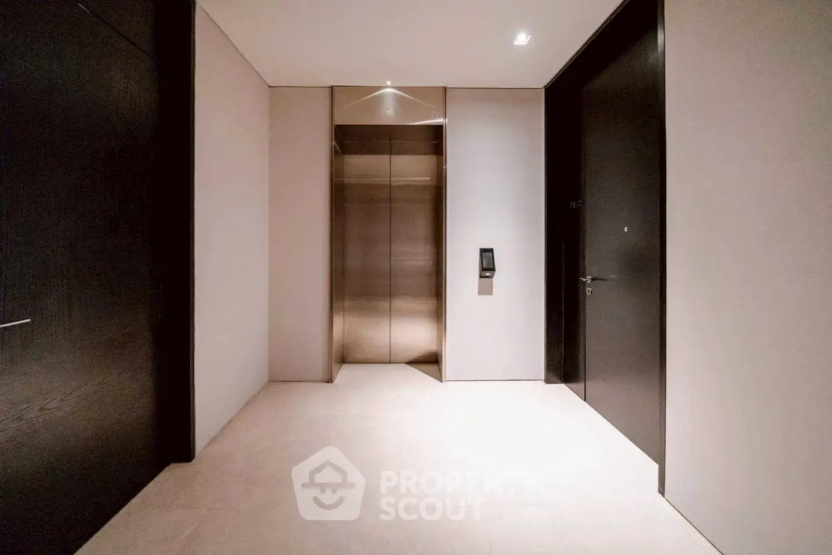 Modern building interior with sleek elevator and minimalist design