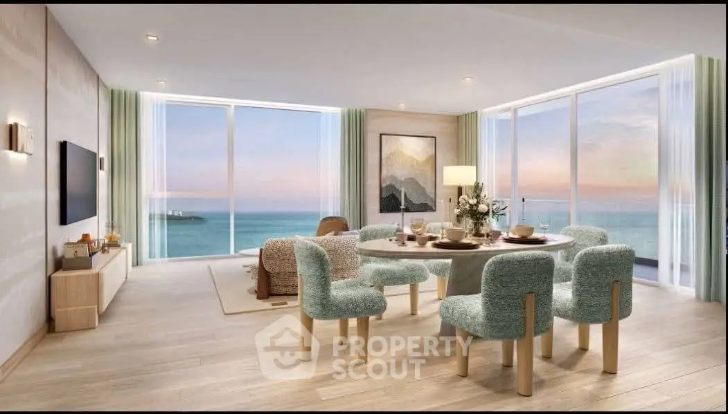 Luxurious living room with stunning ocean view and elegant dining setup.