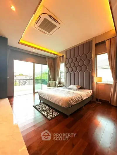 Luxurious bedroom with elegant design and spacious balcony access