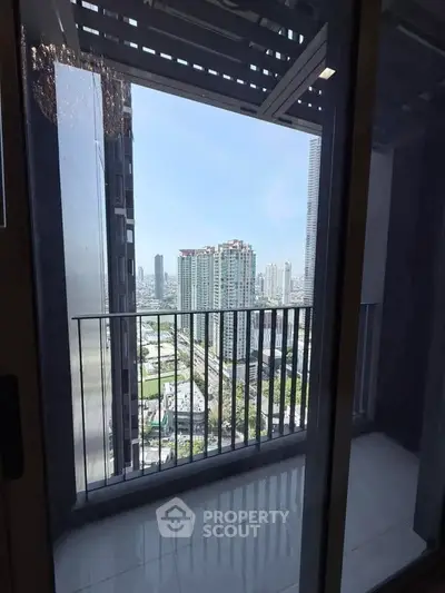 Stunning city view from a modern high-rise balcony, perfect for urban living.