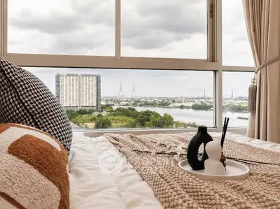 Luxurious bedroom with stunning river view and modern decor