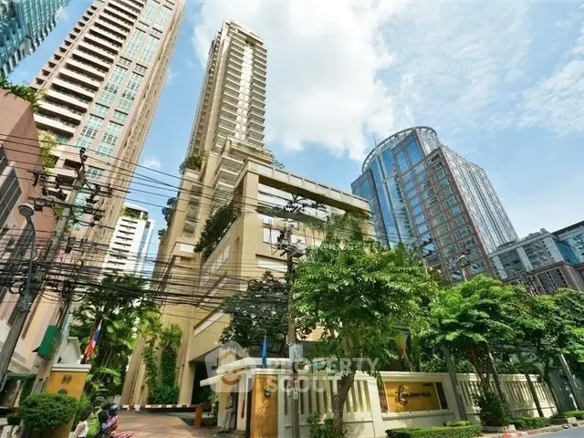 Stunning urban high-rise building with lush greenery and modern architecture in a vibrant cityscape.
