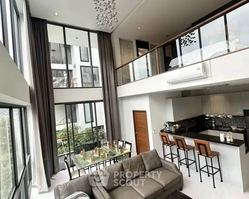 Luxurious modern living room with high ceilings and open kitchen layout