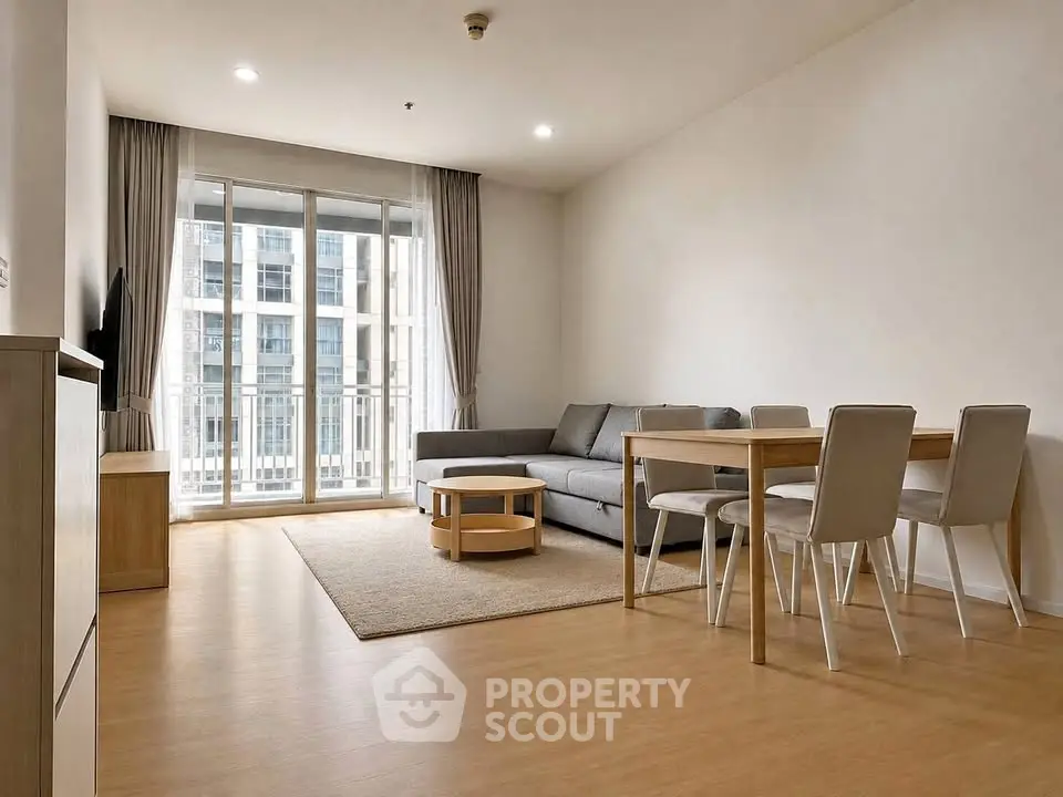 Spacious modern living room with large windows and stylish furniture