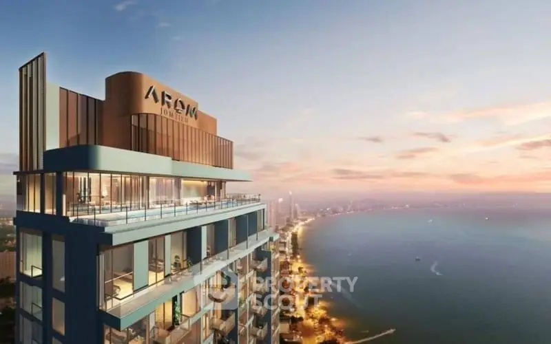 Stunning high-rise building with breathtaking ocean view at sunset.