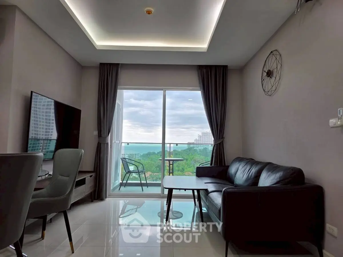 Modern living room with sleek furniture and stunning balcony view