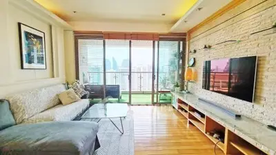 Spacious living room with stunning city view and modern decor