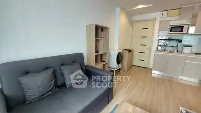 Modern living room with sleek kitchen in open layout apartment