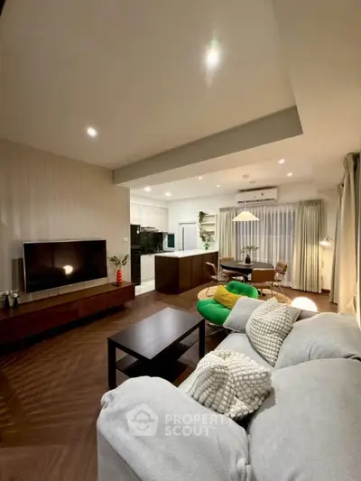 Spacious modern living room with open kitchen and stylish decor