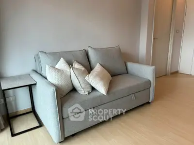 Modern living room with stylish gray sofa and elegant decor
