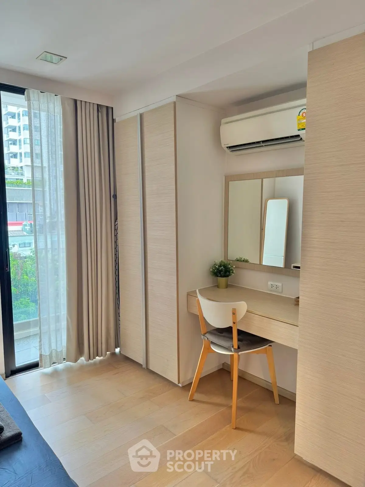 Modern bedroom with natural light and stylish wooden furniture