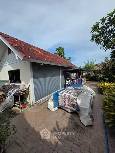 Charming suburban home with red-tiled roof and spacious driveway