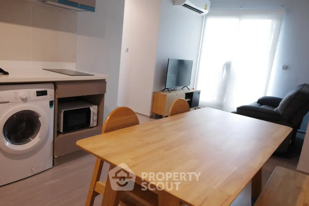 Modern apartment interior with open layout kitchen and cozy living area