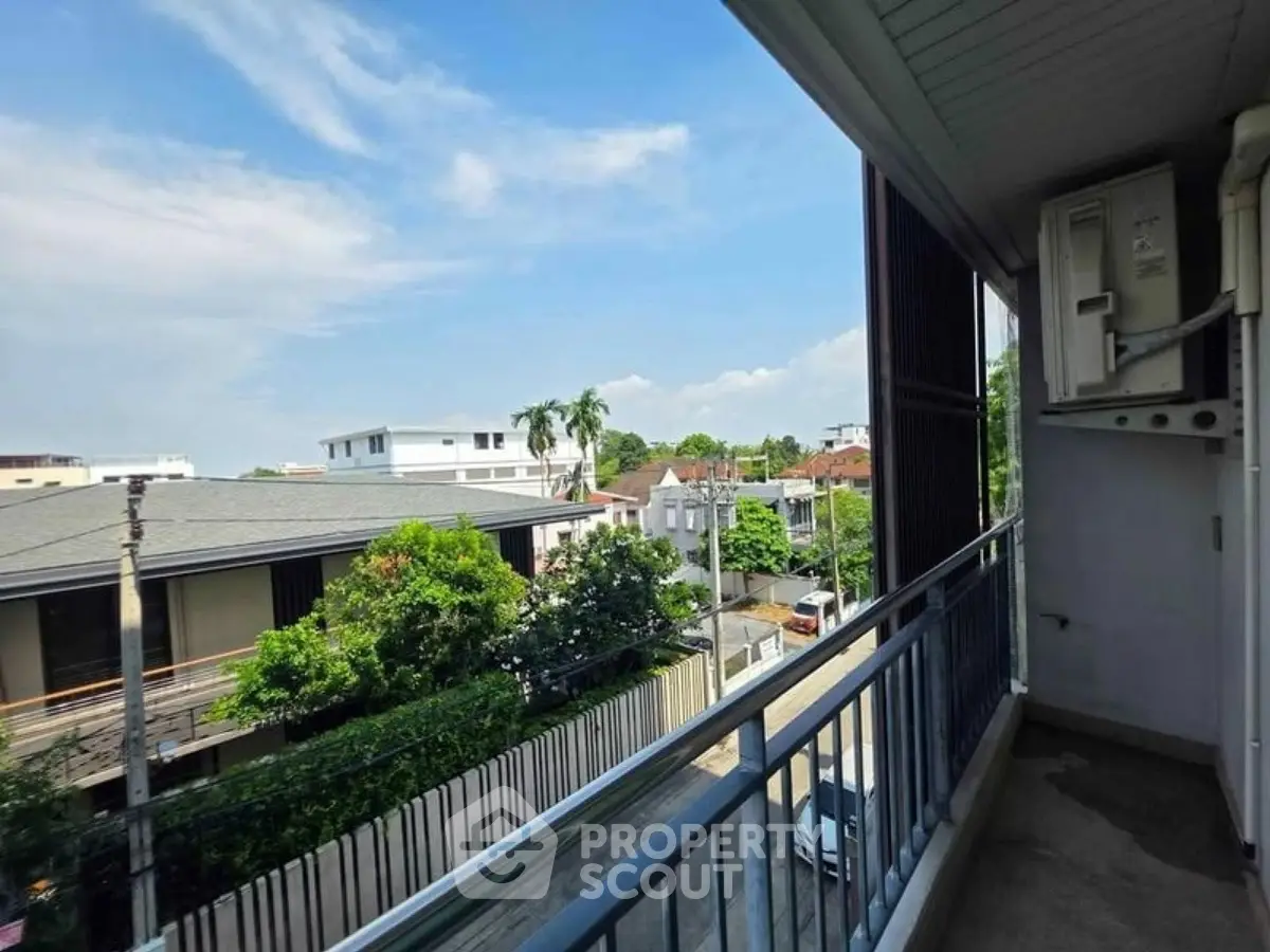 Spacious balcony with scenic neighborhood view in modern apartment