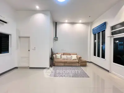 Spacious modern living room with cozy sofa and elegant decor