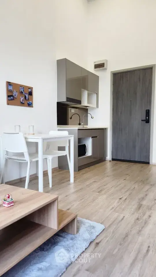 Modern compact kitchen with dining area in stylish apartment