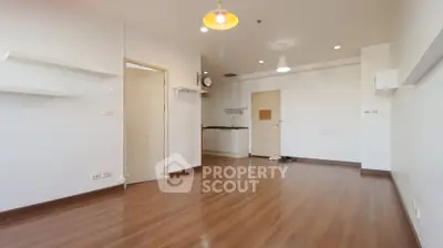 Spacious modern apartment interior with wooden flooring and open layout