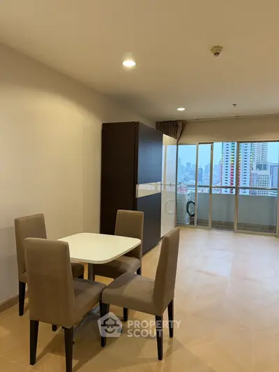 Spacious dining area with city view in modern apartment