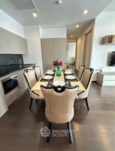 Elegant dining area with modern kitchen in luxury apartment