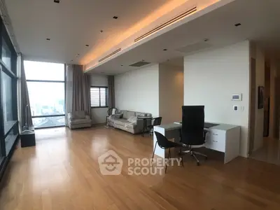 Spacious modern living room with city view and elegant wooden flooring