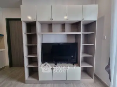 Modern living room with sleek entertainment center and flat-screen TV