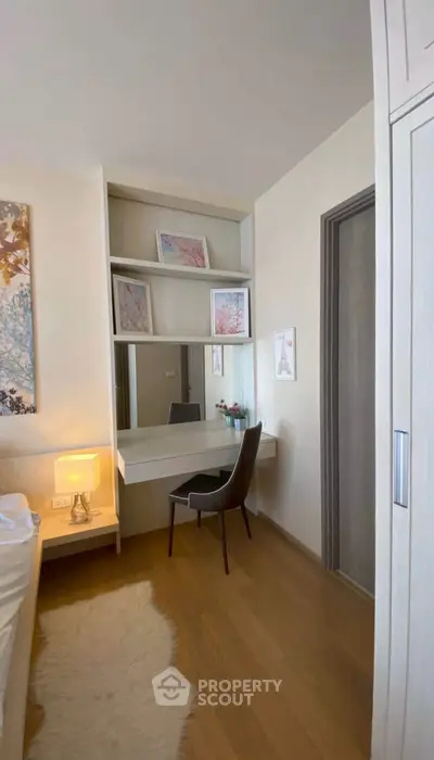 Chic bedroom with modern vanity and cozy decor, perfect for relaxation and style.